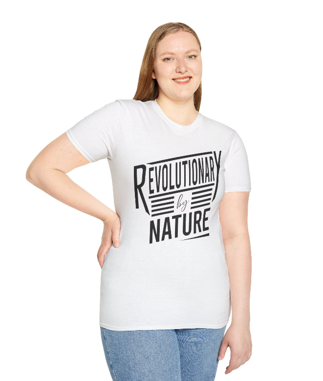 Woman wearing a white Revolutionary by Nature T-shirt with bold black lettering, symbolizing alignment, healing, and self-expansion.